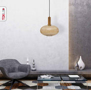 Golden bronze metal amber glass globe pendant light l with e27 fitting in indoor setting