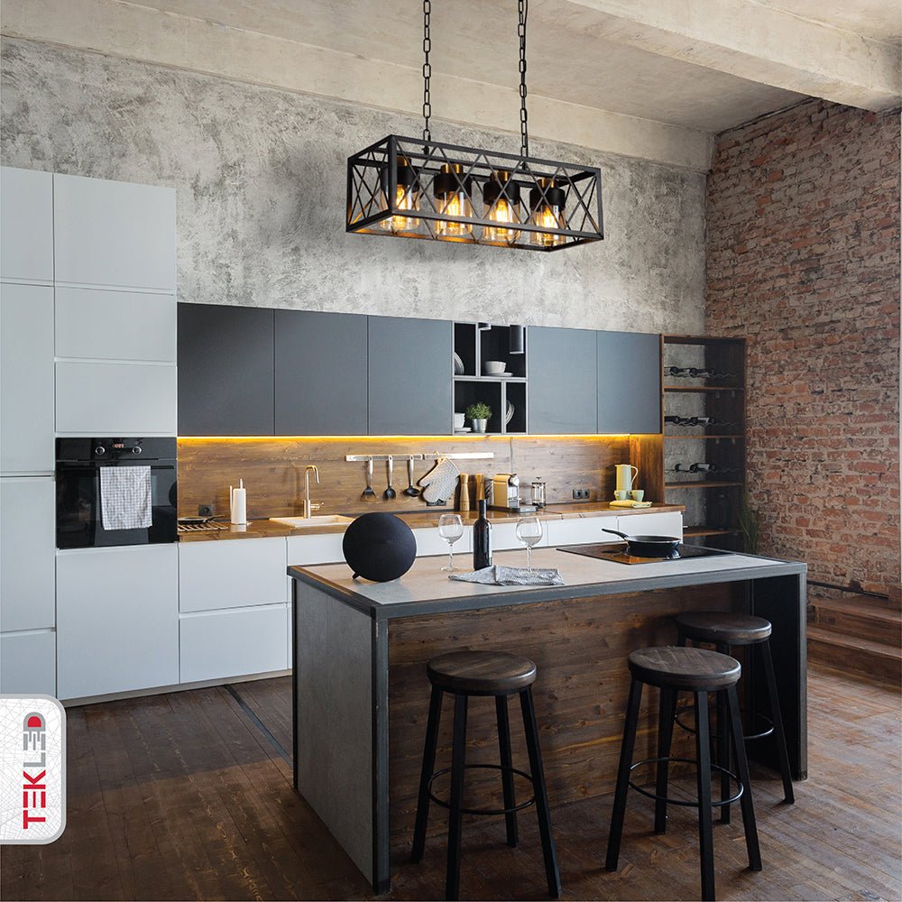 Black cuboid metal amber cylinder glass island chandelier with 4xe27 fitting in indoor setting island kitchen