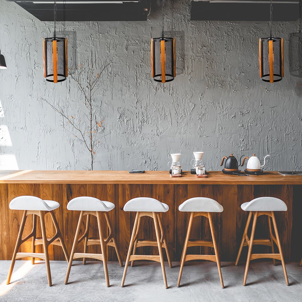 Black metal wood cylinder pendant light with e27 fitting in indoor setting bar top