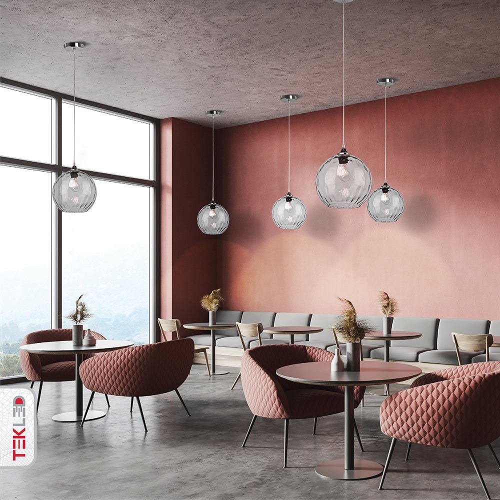 Clear glass globe pendant light with e27 fitting in indoor setting cafe restaurant