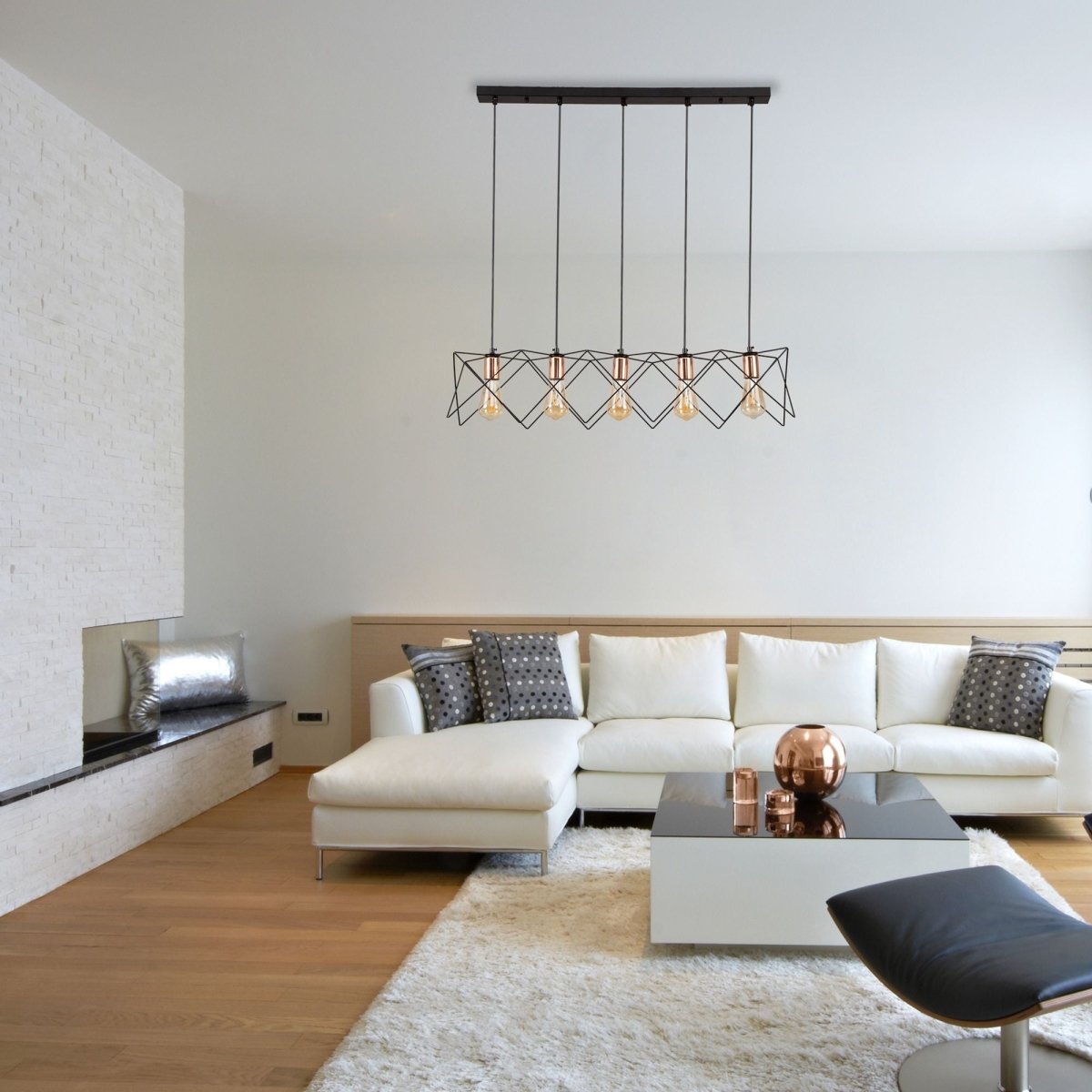Black metal caged island chandelier with 5xe27 fitting in indoor setting living room