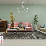White metal 3 arm chandelier with 3xe14 fitting in indoor setting living room